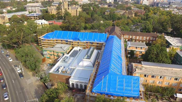 Areal image of a building with roofing project by Flynn Tarp Hire